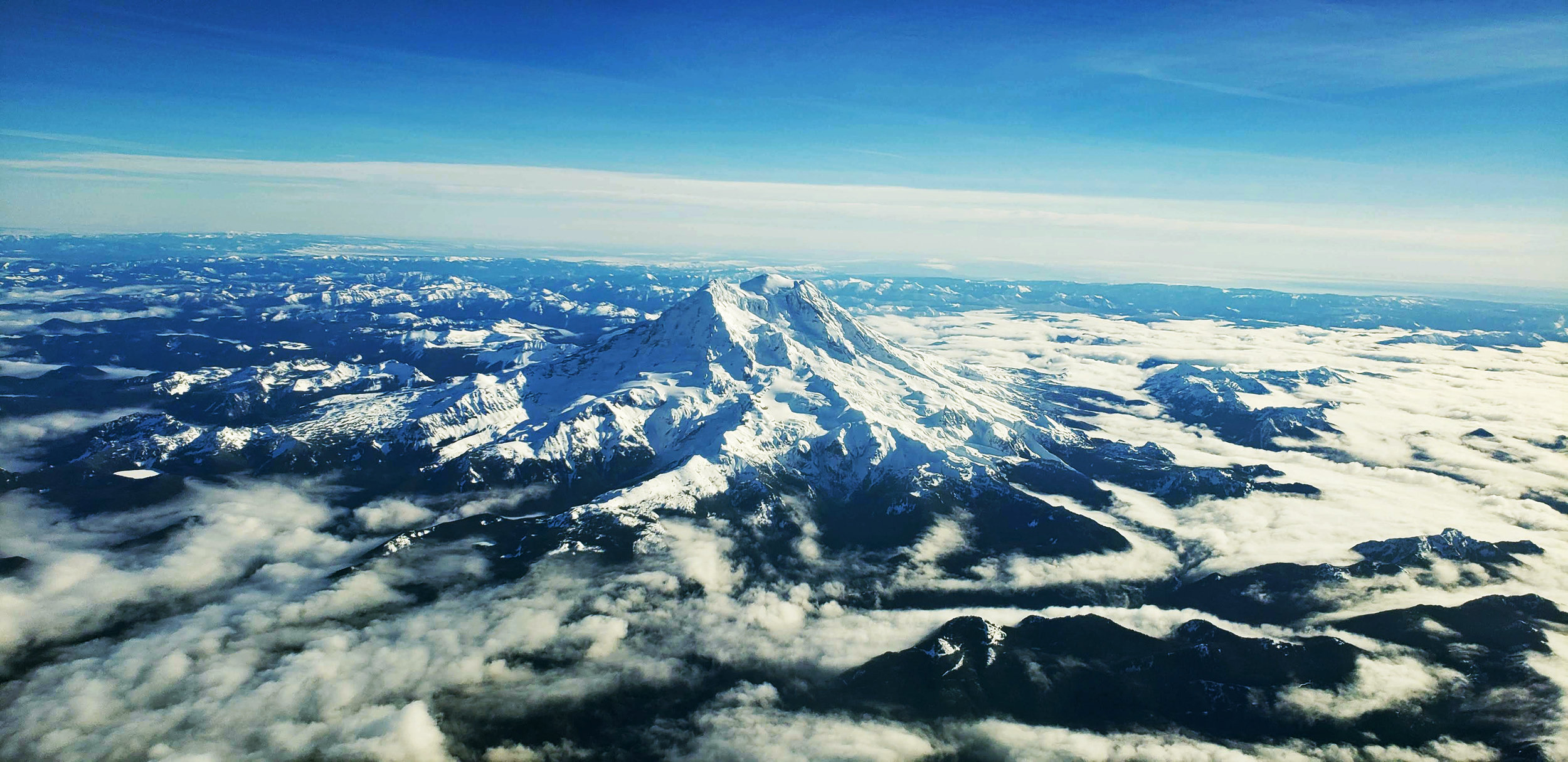 sky view of mt rainier coverd in snow